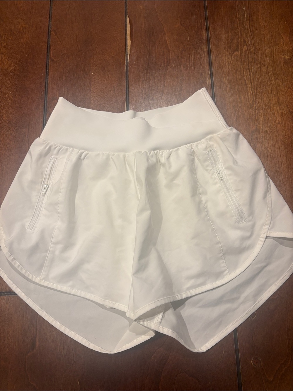 High-Waist White Athletic Shorts with Secure Zip Pockets